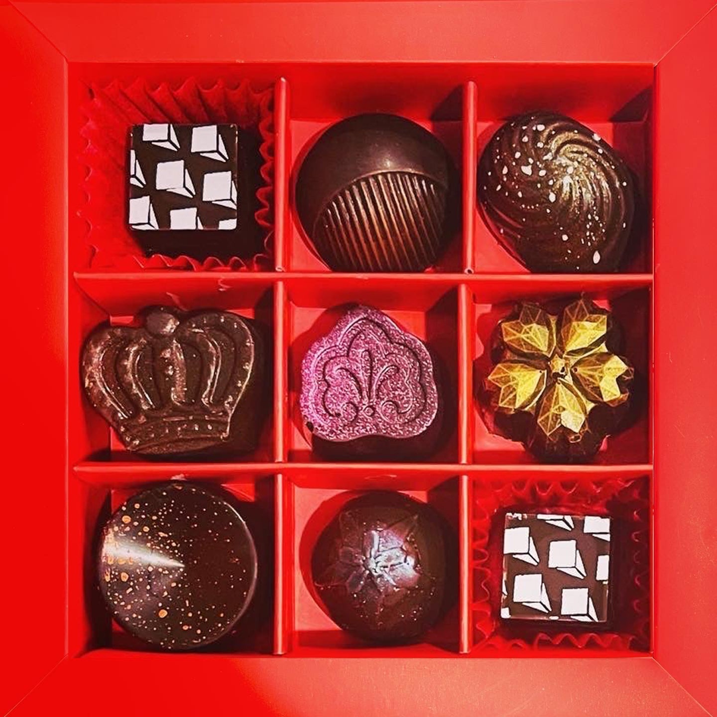 Example 9-piece Le Rouge truffle box; individual chocolates vary with your selection
